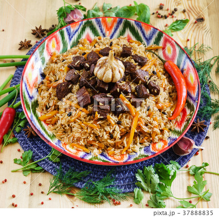 Pilaf with mutton, carrots, onions, garlic, pepper and cumin. A traditional dish of Asian cuisine. 37888835