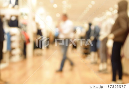 blurred image people walking in shopping centre. blurred image people walking in shopping centre. 37895377