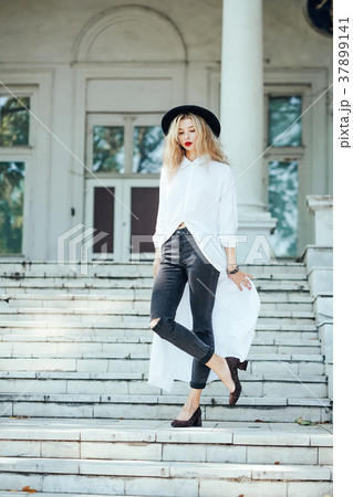 Girl is posing on the stone steps 37899141