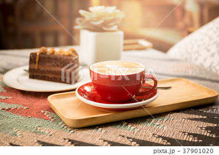 Coffee and piece of macadamia chocolate cake 37901020