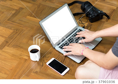Morking on laptop computer with camera and coffee Morking on laptop computer with camera and coffee 37901036
