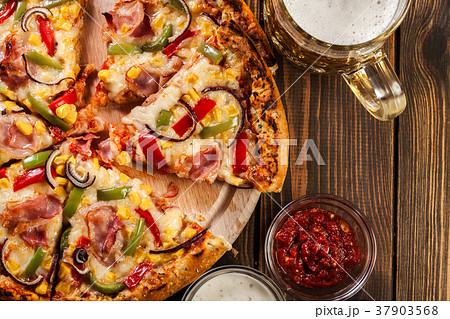 Homemade pizza with bacon, paprika and corn Homemade pizza with bacon, paprika and corn 37903568