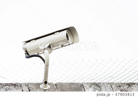 surveillance camera fixed on the wall of a prison 37903813