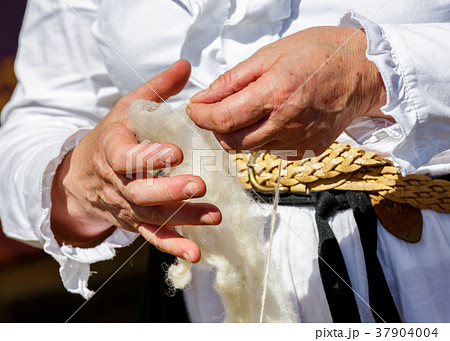 cotton spinner transforming raw wool 37904004