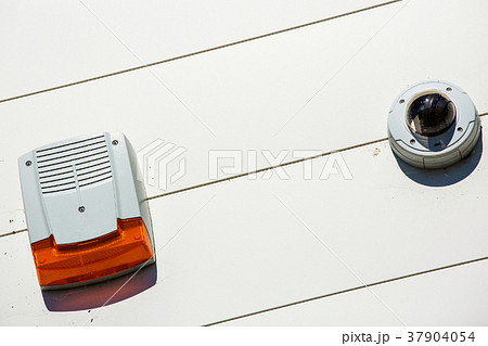 close up on security alarm box and cctv on a wall close up on security alarm box and cctv on a wall 37904054