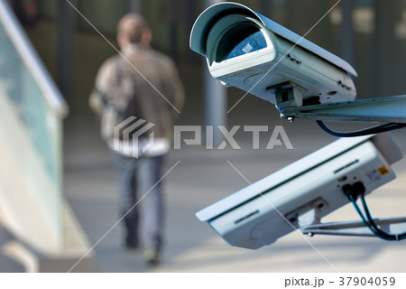 CCTV camera system with man on blurry background CCTV camera system with man on blurry background 37904059