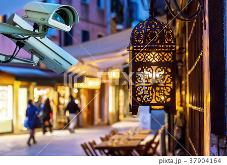 CCTV camera street by night on blurry background 37904164