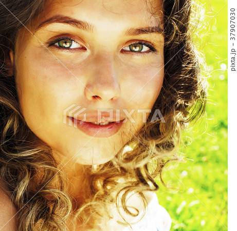 young cute summer girl on green grass outside young cute summer girl on green grass outside 37907030