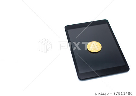 Golden bitcoin on blank screen digital tablet. Golden bitcoin on blank screen digital tablet. 37911486