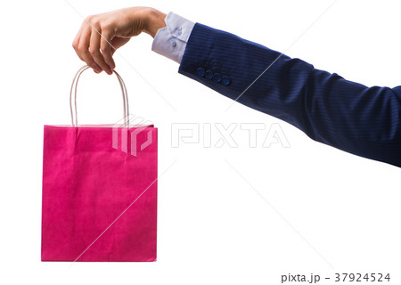 Hand holding shopping bags with christmas shopping Hand holding shopping bags with christmas shopping 37924524