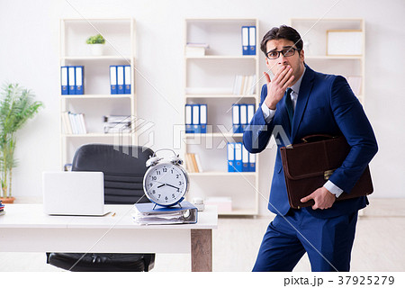 Businessman in rush trying to meet deadline Businessman in rush trying to meet deadline 37925279