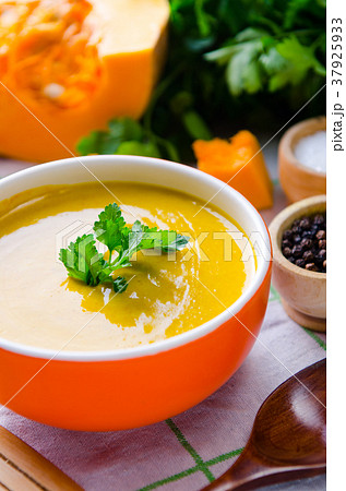 Pumpkin soup served on the table in bowl Pumpkin soup served on the table in bowl 37925933