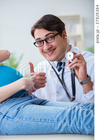 Doctor examining pregnant female patient in 37926364