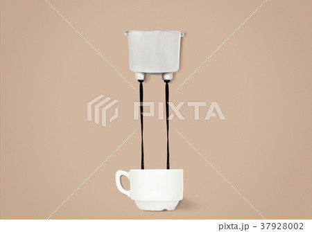 Two jets of coffee pouring from a group of handle 37928002