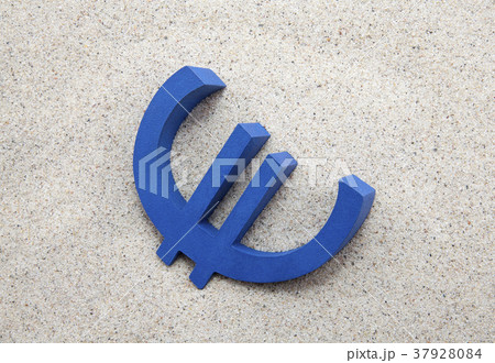 Blue euro symbol in the sand  37928084