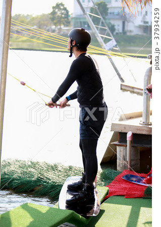 Surfing at the water sports arena. Surfing at the water sports arena. 37934259