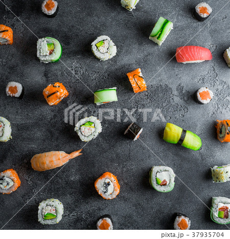 Pattern with sushi rolls on dark background Pattern with sushi rolls on dark background 37935704