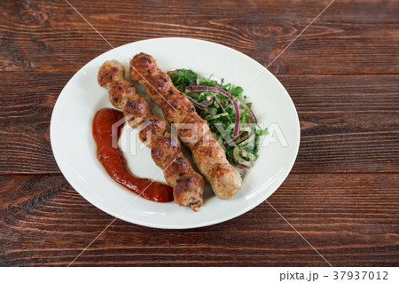 Portion luleh kebab on a plate. Portion luleh kebab on a plate. 37937012