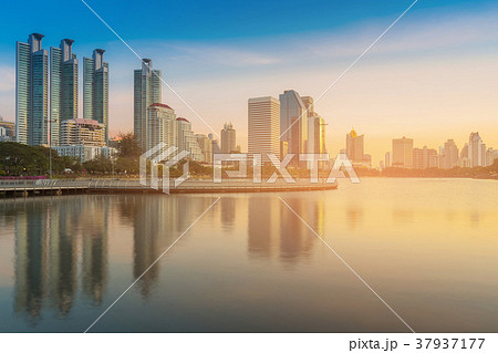 Water lake in public park with office building 37937177