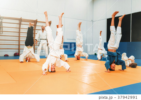 Children karate, kids practice martial art in hall Children karate, kids practice martial art in hall 37942991