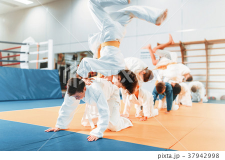 Kid judo, childrens in kimono training martial art Kid judo, childrens in kimono training martial art 37942998