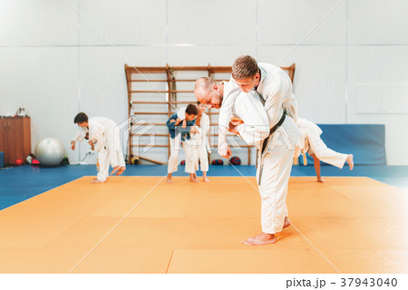 Kid judo, young fighters on training in hall 37943040