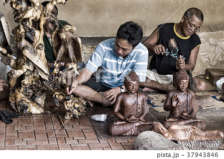 Men are making wooden crafts in Indonesia Men are making wooden crafts in Indonesia 37943846