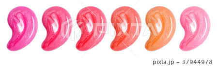 Set of different colors lip glosses smear isolated on white. Makeup sample. 37944978