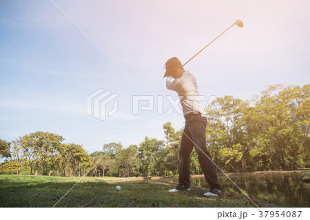 golf player swinging driver golf club 37954087