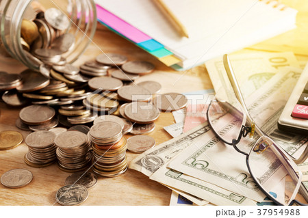 coins and dollar banknote 37954988