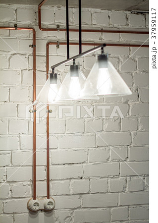 A vintage outlet and electrical wiring in a copper A vintage outlet and electrical wiring in a copper 37959117