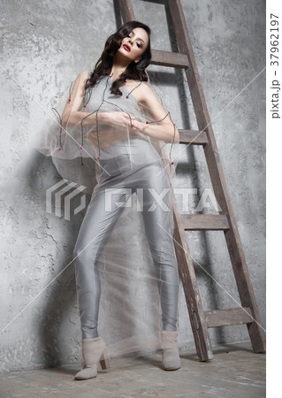 Beautiful girl in designer fashionable transparent Beautiful girl in designer fashionable transparent 37962197