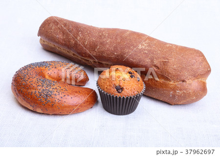 Many mixed breads and muffins on white background 37962697