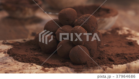 handmade truffles in cocoa powder on board 37964686