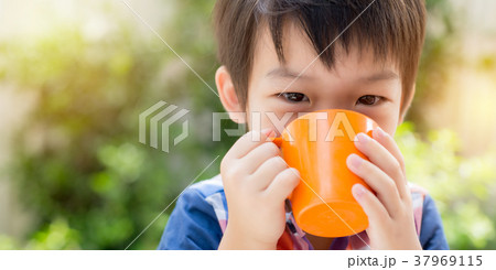 Asian Boy Drinking Milk in the Morning 37969115