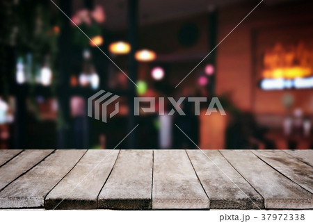 Empty wooden table and blurred background of abstract in front o 37972338
