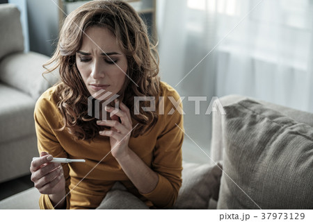 Pregnant woman checking her analysis Pregnant woman checking her analysis 37973129
