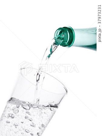 Pouring sparkling mineral water from bottle 37973231