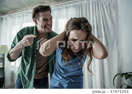 Mad husband shouting at wife Mad husband shouting at wife 37973263