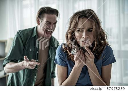 Terrified lady suffering from male cruelty 37973289