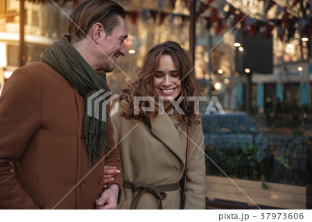 Happy couple walking outdoor with pleasure 37973606