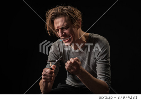 Man in drug hangover readying dose 37974231