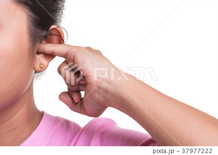 Close up woman trying cleaning her ear by using her finger isolated on white Close up woman trying cleaning her ear by using her finger isolated on white 37977222
