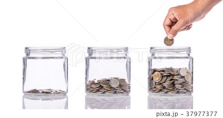Thai coin (baht) in clear glass jar with different level from less to more. Studio shot isolated on white. Save money or investment financial for future concept 37977377