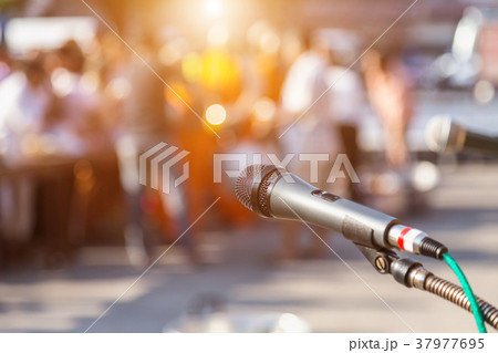 Microphone and blur of people at the school Microphone and blur of people at the school 37977695