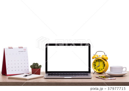 Modern laptop computer, Coffee cup, alarm clock, notebook and calendar on wooden table. Studio shot isolated on white. Blank screen for graphics display montage Modern laptop computer, Coffee cup, alarm clock, notebook and calendar on wooden table. Studio shot isolated on white. Blank screen for graphics display montage 37977715
