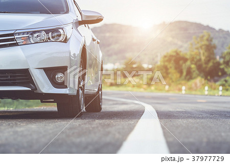Close up front of new silver car parking on the asphalt road 37977729