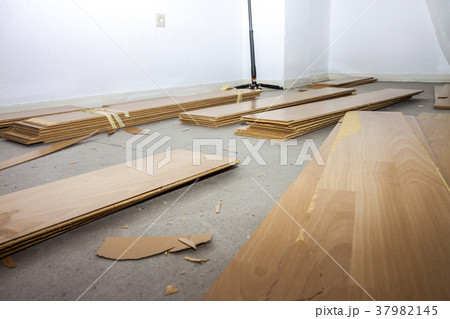 Room full of removed laminate lying on floor 37982145