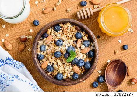 Granola bowl with blueberries, almonds and honey 37982337