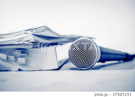 Close up a Microphone with paper document Close up a Microphone with paper document 37985291